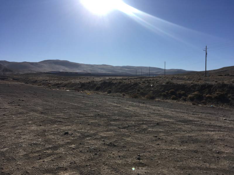 The Tesla Gigafactory only appears as a thin line on the landscape. 