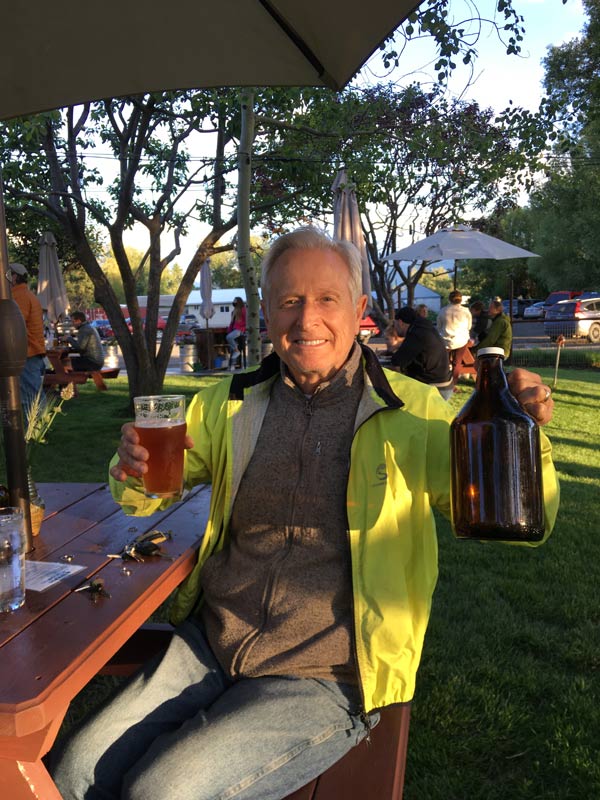 John at the Terminal Gravity Brewery in Enterprise, Oregon holding a pint and a growler of IPA - the finest in all the land!